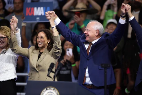 Photo · Kamala Harris and Tim Walz at a 2024 campaign rally