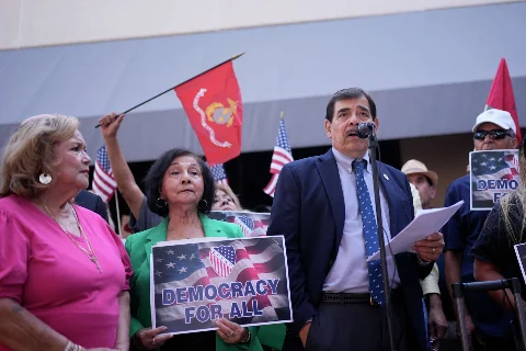 Photo · LULAC members at a Democracy for All rally